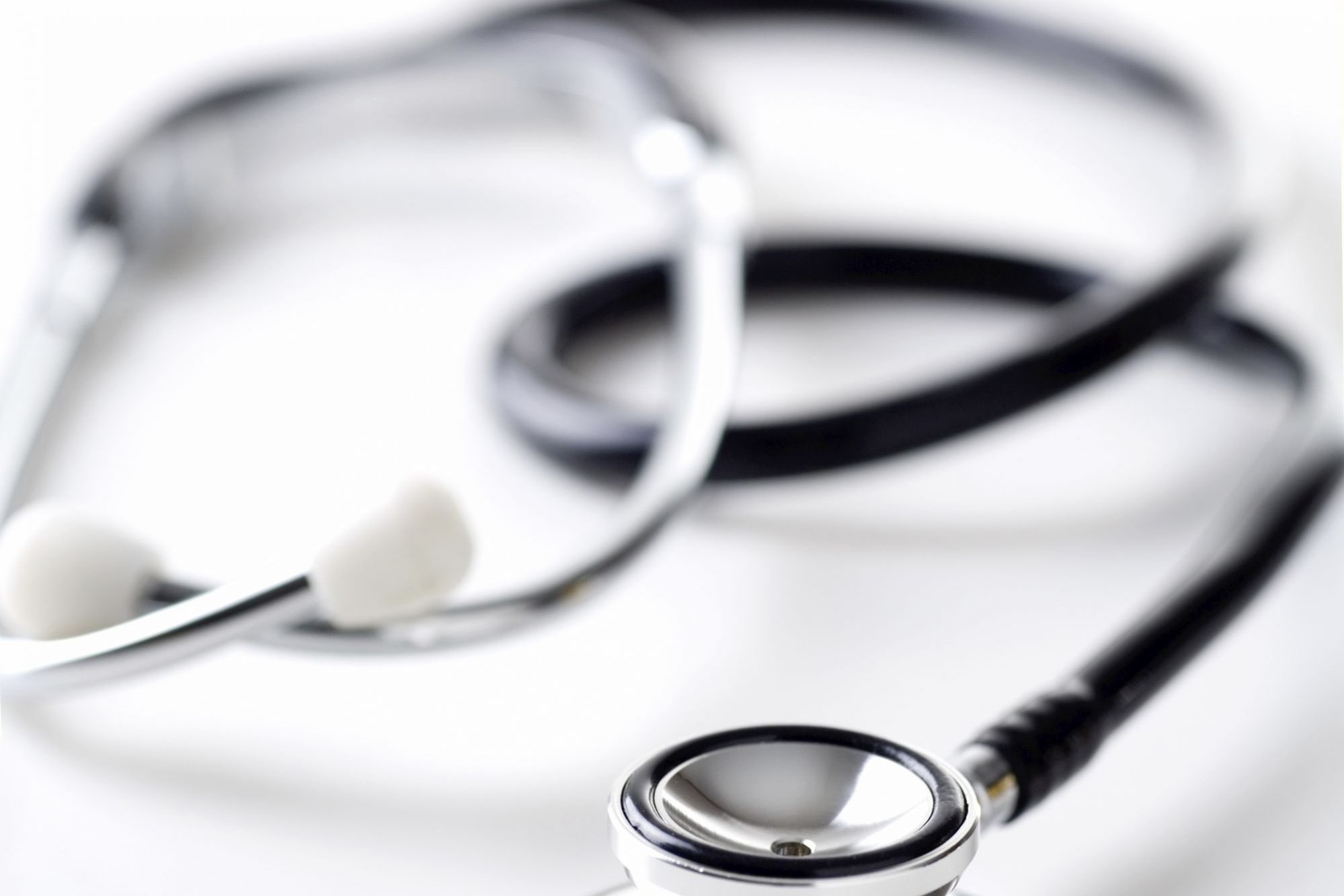 Stethoscope on White. Shallow DOF with selective focus on the head.