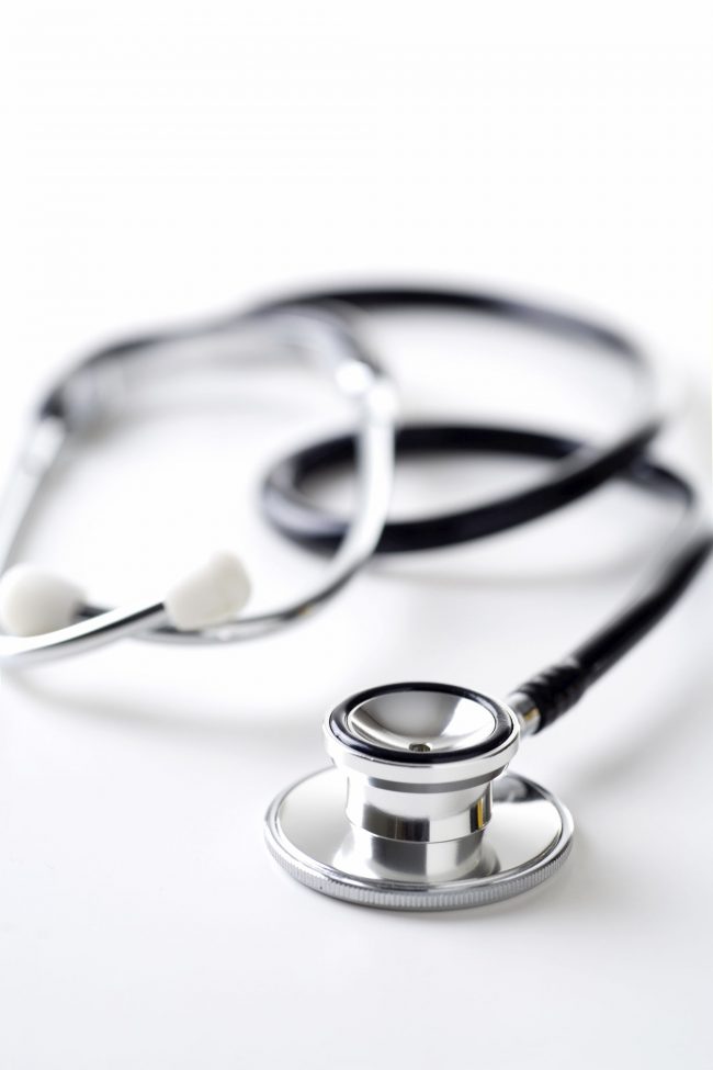 Stethoscope on White. Shallow DOF with selective focus on the head.